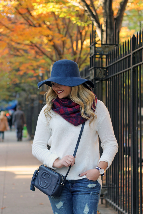 fall outfit hat, blanket scarf, white sweater, ripped jeans