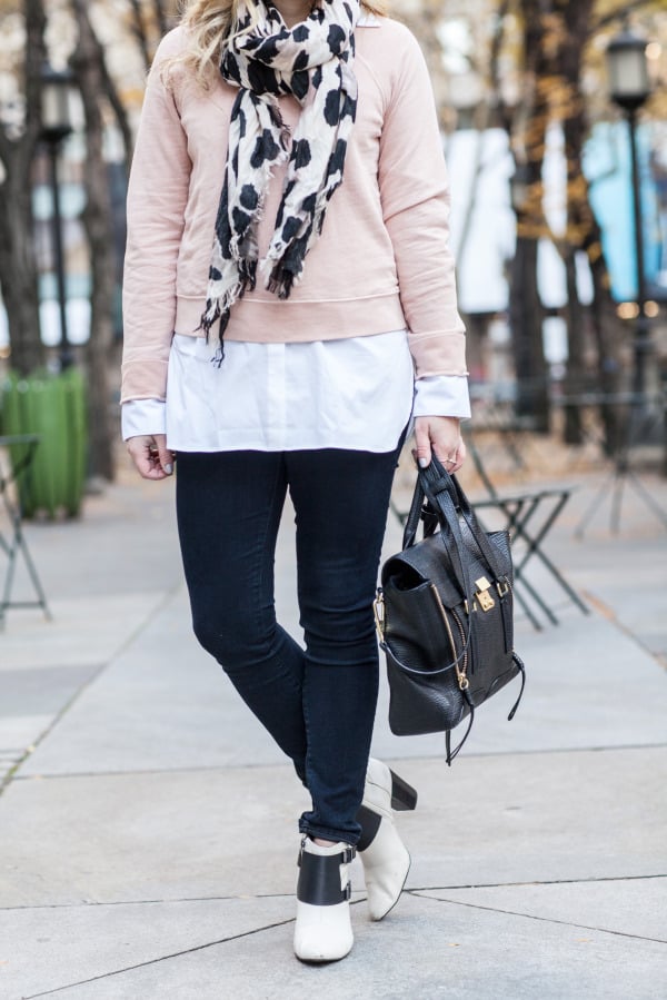 long white shirt layered under sweatshirt