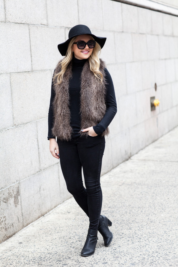 all black outfit nyc hat floppy fur vest