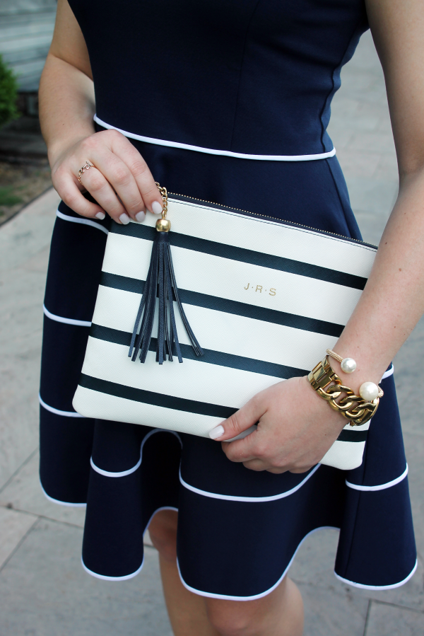 striped-tassel-monogram-clutch