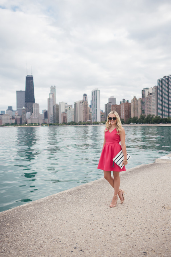 pink dress, nude heels, navy striped clutch