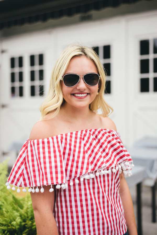 red and white gingham top off the shoulder pom poms