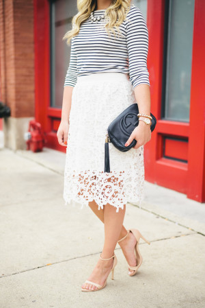 Bows & Sequins wearing a striped tee and a long lace skirt.