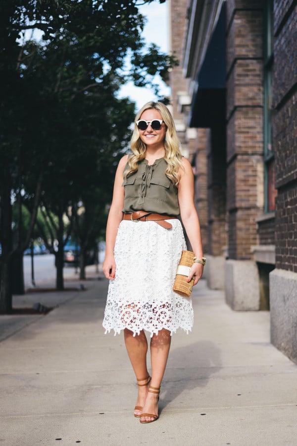 green blouse, white lace skirt, leather belt and sandals