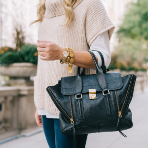 Jessica Sturdy styling a cowl neck sweater with a black Phillip Lim Pashli tote.