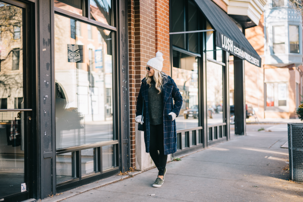 white beanie with fur pom pom