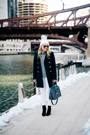 Bows & Sequins wearing a winter outfit with white jeans in Chicago.