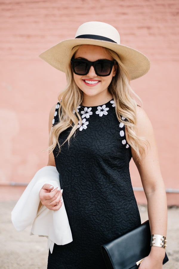 black dress with white flowers, white jacket, summer straw hat wide brim