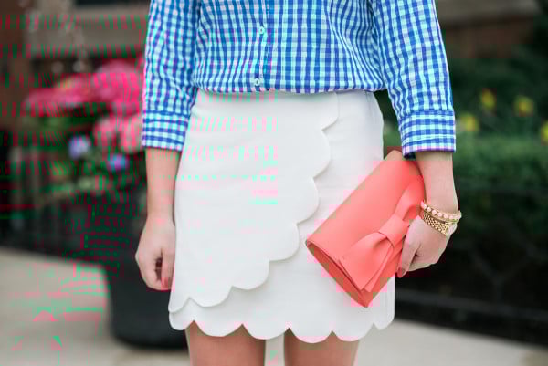 blue gingham shirt, white scalloped skirt, coral bow clutch outfit for spring