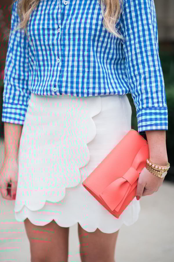 blue gingham shirt, white scalloped skirt, coral bow clutch spring outfit ideas