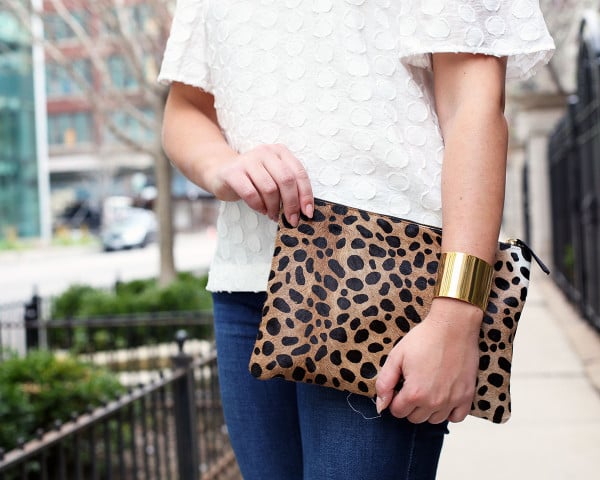 white polka dot top, leopard clutch, gold cuff bracelet