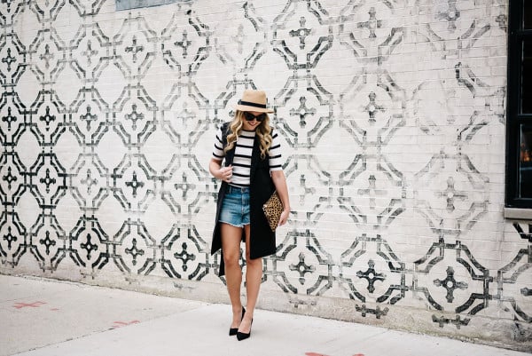 womens outfit short denim shorts with high heels and a long vest