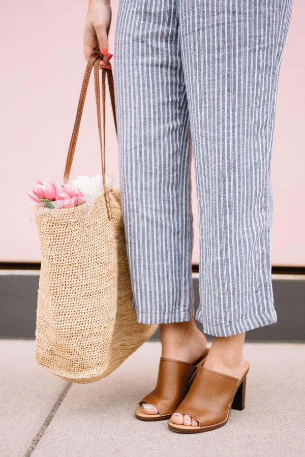 blue and white striped pants, leather mules, straw tote, tulips