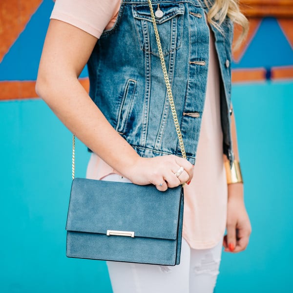 ivanka trump handbag, blue suede crossbody bag, gold chain strap, denim vest outfit