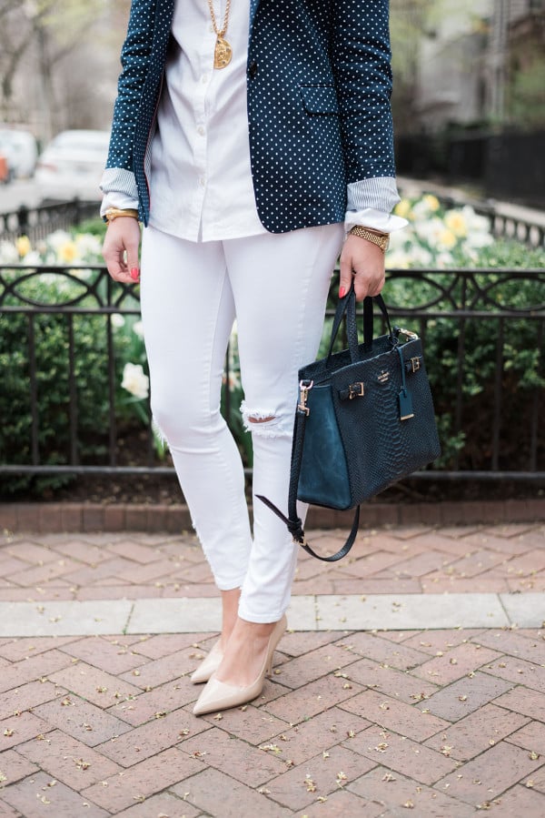 Fashion blogger showing how to wear white jeans to the office.