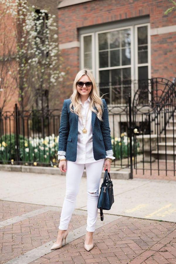 Fashion blogger, Jessica Sturdy of bows & sequins, wearing a polka dot blazer and white denim jeans. 
