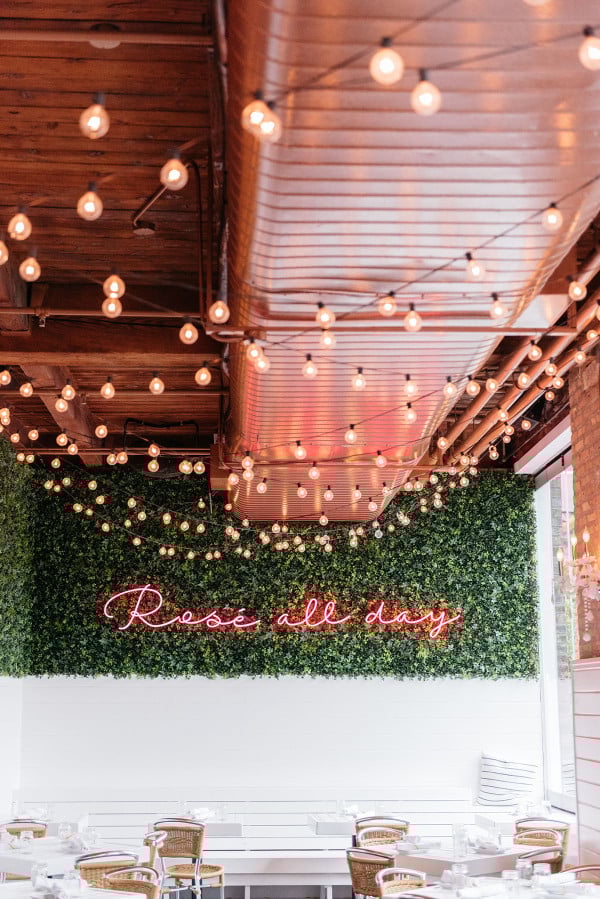Rosé All Day neon sign at The Hampton Social in Chicago. Bows & Sequins favorite French rosé wines.