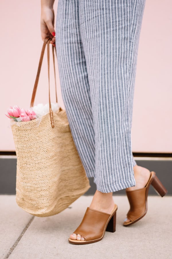 straw tote, leather mules, linen pants