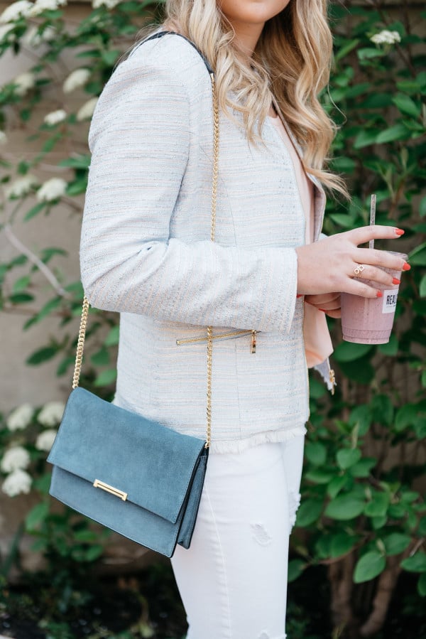 Bows & Sequins swearing a metallic tweed jacket and a blue suede Ivanka Trump cross-body bag with a gold chain.