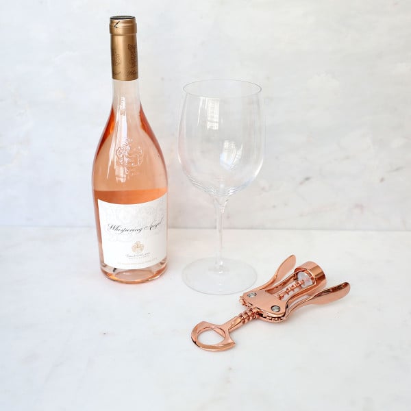 Whispering Angel is one of the best Provence rosés on the market! Shown here with a rose gold copper wine opener.