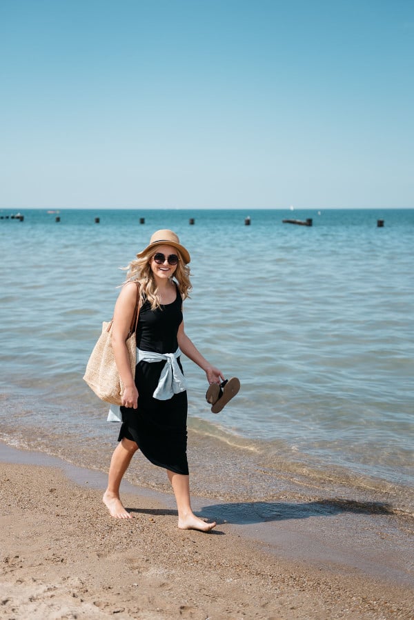 Bows & Sequins at North Avenue Beach in Chicago wearing a black maxi dress and chambray shirt.