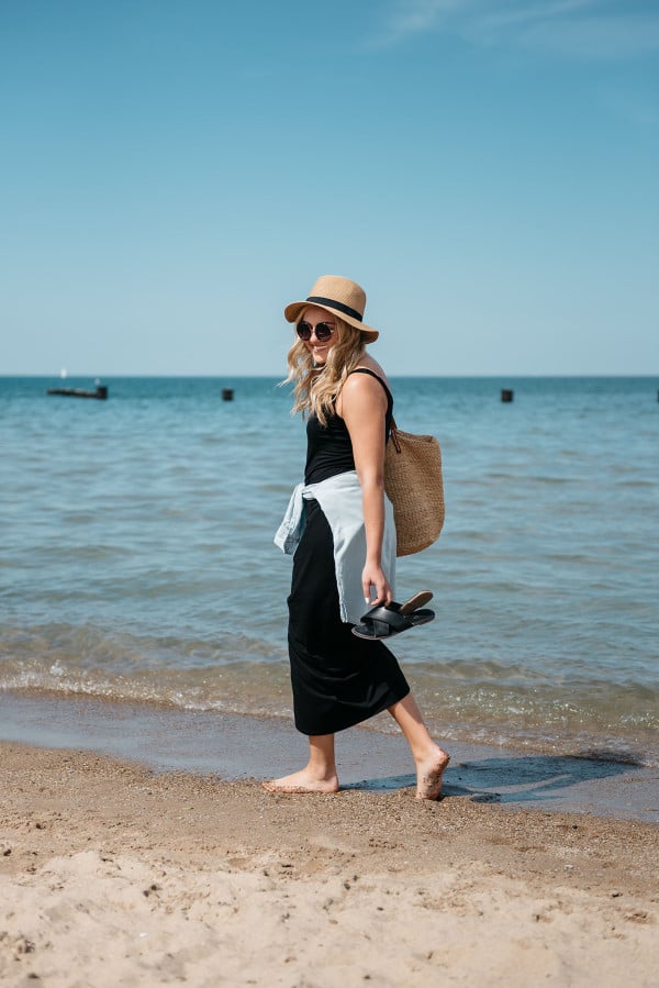 Sequins at North Avenue Beach in Chicago wearing a black maxi dress and chambray shirt.
