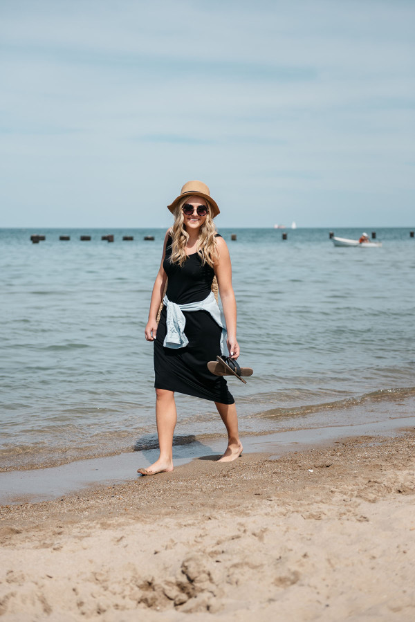 Sequins at North Avenue Beach in Chicago wearing a black maxi dress and chambray shirt.