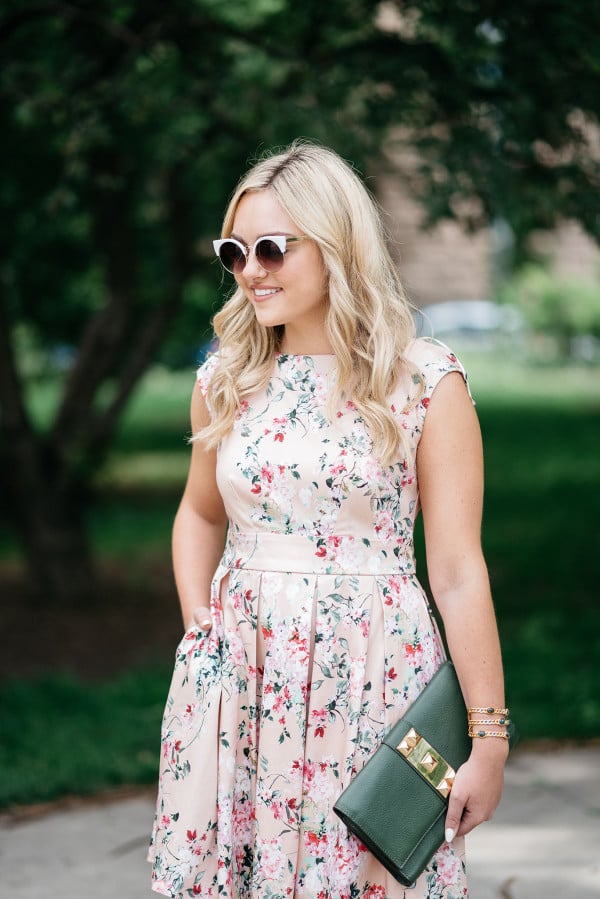 Bows & Sequins wearing a peach floral dress from Modcloth for a summer wedding.
