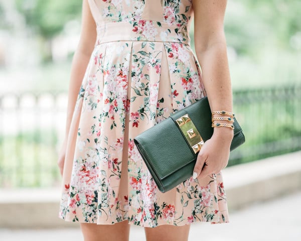 Bows & Sequins wearing a peach floral dress from Modcloth for a summer wedding.