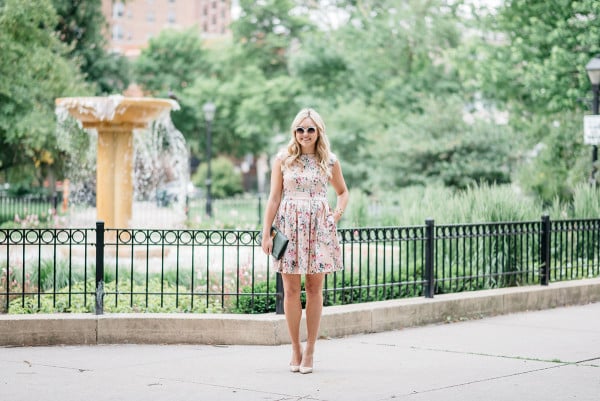 Bows & Sequins wearing a peach floral dress from Modcloth for a summer wedding.