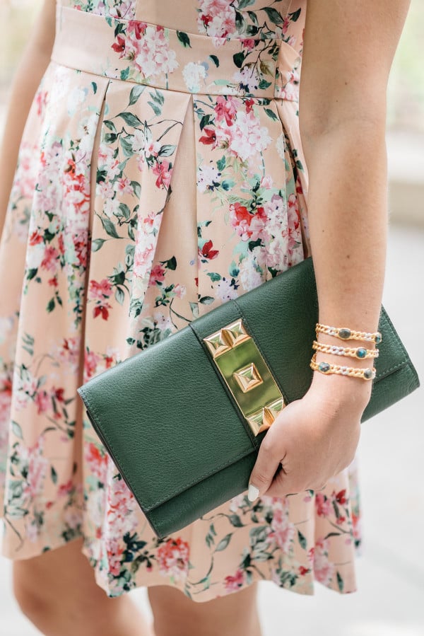 Bows & Sequins wearing a peach floral dress from Modcloth for a summer wedding.