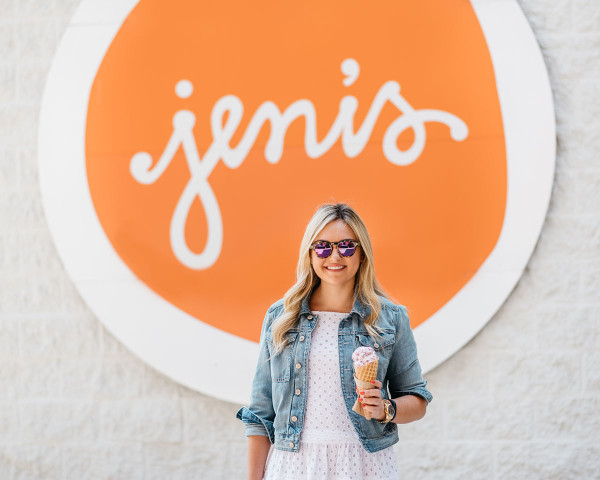 Bows & Sequins at Jeni's Ice Cream in Chicago on Southport Corridor. Jessica is wearing a Sail to Sable white eyelet dress, a denim jacket, a J.McLaughlin rattan handbag, Illesteva tortoise sunglasses with pink mirrored lenses, and J.Crew blue gingham bow-tied knotted slides.