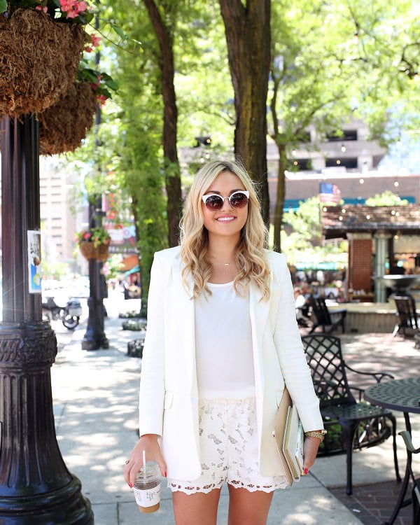 Bows & Sequins wearing an all-white outfit that's perfect for going from the workday to dinner and drinks! Pair a long-line white blazer with a silky tank and lace shorts for a chic summertime look.