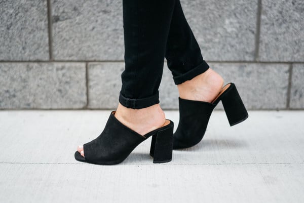 Bows & Sequins wearing a pair of black suede peep-toe mules from Topshop.