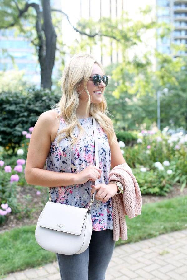 Bows & Sequins wearing a floral paisley-printed top from Old Navy, a Kate Spade crossbody bag, and Dior sunglasses.