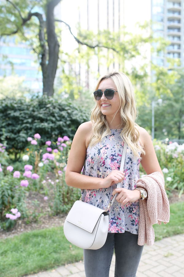 Bows & Sequins wearing a floral paisley-printed top from Old Navy, a Kate Spade crossbody bag, and Dior sunglasses.