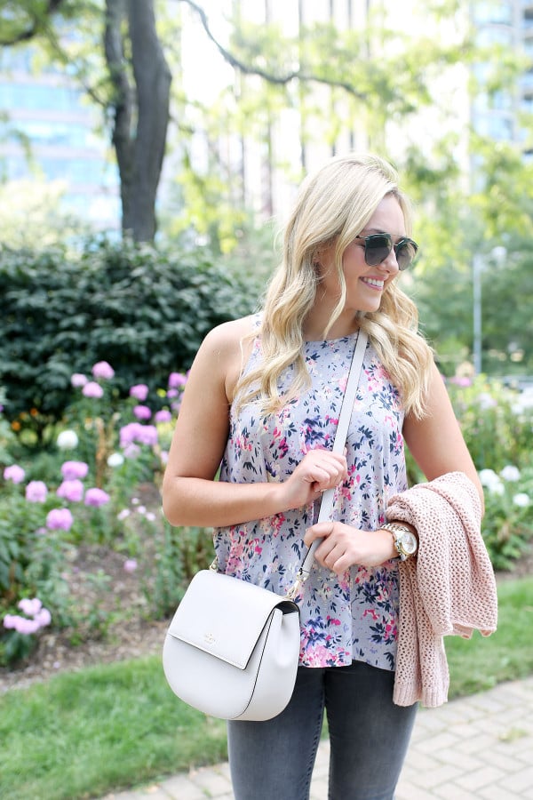 Bows & Sequins wearing a floral paisley-printed top from Old Navy, a Kate Spade crossbody bag, and Dior sunglasses.