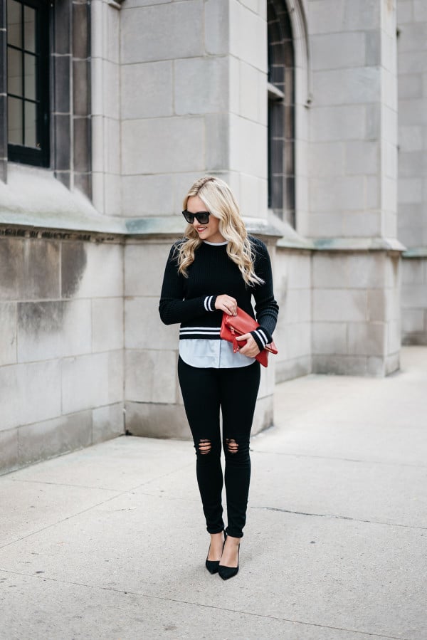 Jessica Sturdy of Bows & Sequins, a fashion-focused lifestyle blog, styling a black and white stripe Nordstrom sweater, black ripped jeans, black pumps, sunglasses, and a red purse.