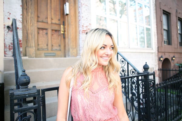 Blogger Bows & Sequins wearing a pink lace dress during NYFW paired with a glammed up everyday beauty look from Mary Kay!