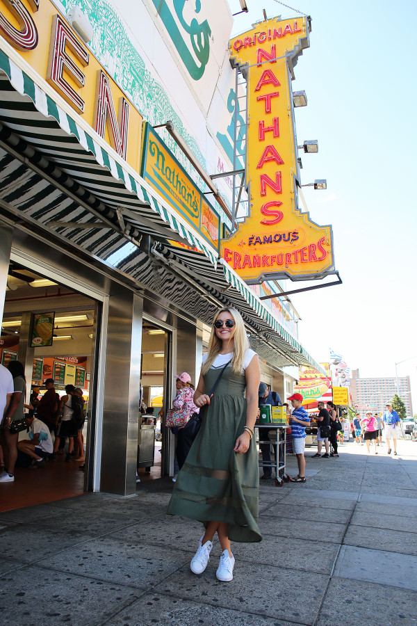 Bows & Sequins styling a white J.Crew tee shirt under an Azalea cami-strap dress with a Gucci crossbody bag, Illesteva sunglasses, and Stan Smith Sneakers.