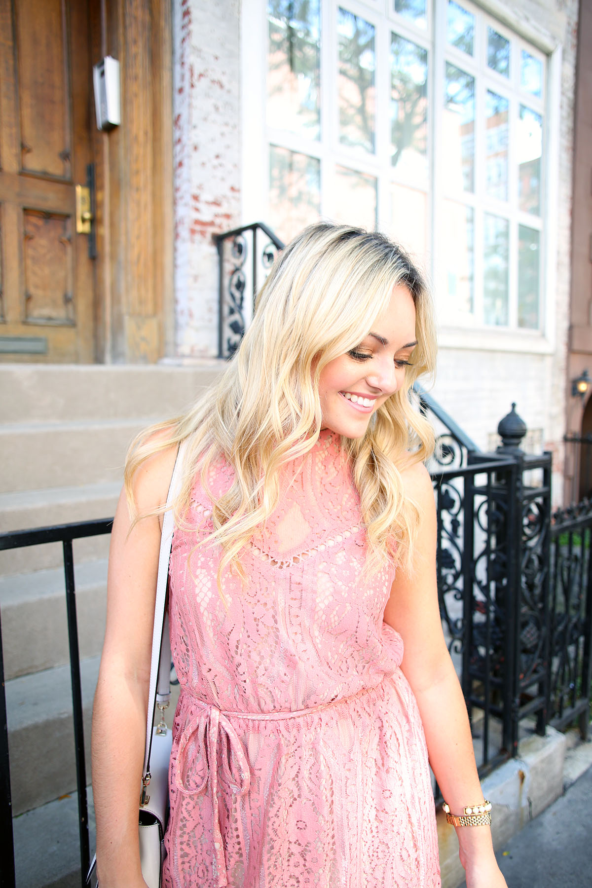Blogger Bows & Sequins wearing a pink lace dress during NYFW paired with a glammed up everyday beauty look from Mary Kay!