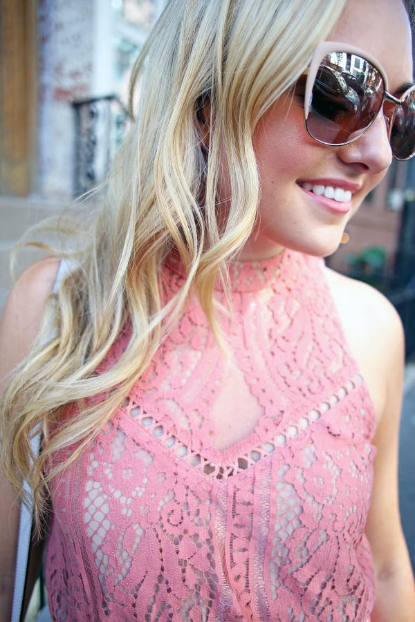 Fashion blogger Bows & Sequins wearing a Wayf pink lace dress with blush pink sunglasses. Makeup is Mary Kay!