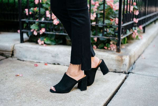 Bows & Sequins wearing black Frame denim with a frayed hem and Topshop suede mules.