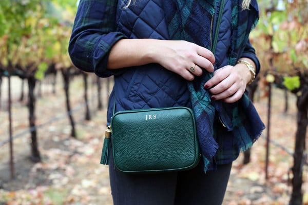 Bows & Sequins wearing a monogrammed tassel crossbody bag in Napa.