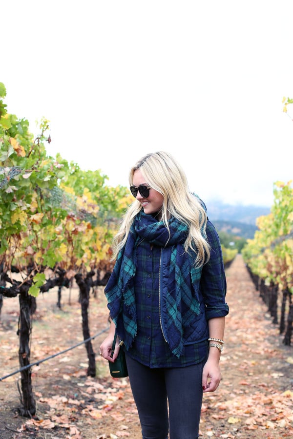 Bows & Sequins wearing a plaid shirt, quilted vest, and a blanket scarf in Napa, California.