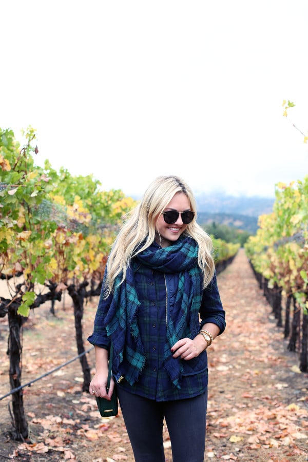 Bows & Sequins wearing a plaid shirt, quilted vest, and a blanket scarf in Napa, California.