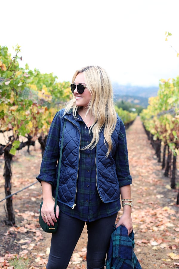 Bows & Sequins wearing a plaid shirt, quilted vest, and a blanket scarf in Napa, California.