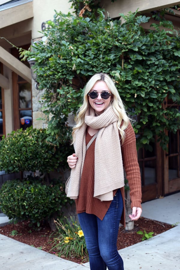Bows & Sequins wearing a rust-colored sweater and cashmere blanket scarf in Napa.