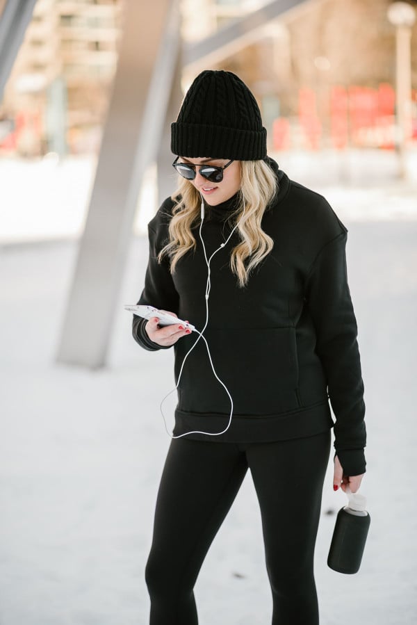 Bows & Sequins wearing a lululemon turtleneck, black sunglasses, and a beanie.