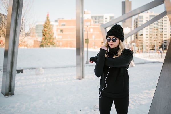 Bows & Sequins wearing a lululemon turtleneck, black sunglasses, and a beanie.